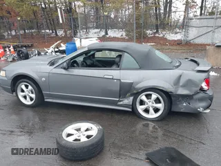 2004 Ford Mustang GT Deluxe z VIN 1FAFP45X74F128442, wystawiony jako IAAI lot #41580930 z przebiegiem 100 801 mil mil oraz . Historia ofert i sprzedaży dostępna na DreamBid. Obrazek 15.
