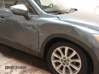 2015 Mazda CX-5 Grand Touring with VIN JM3KE4DY7F0504398, listed as a IAAI auction lot 41698365 with 122,121 mi miles. Bid and sale history available at carsss.com. Image 6.