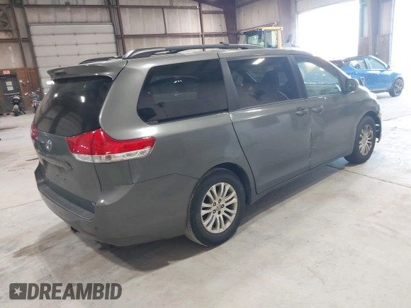 2011 Toyota Sienna XLE AAS with VIN 5TDYK3DC8BS111639, listed as a IAAI auction lot 42108488 with 300,872 mi miles and . Bid and sale history available at DreamBid. Image 4.