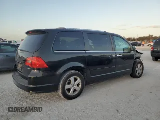 2013 Volkswagen Routan z VIN 2C4RVADG8DR725749, wystawiony jako Copart lot #77624324 z przebiegiem 156 557 mil mil oraz Czysty tytuł • Clean title. Historia ofert i sprzedaży dostępna na DreamBid. Obrazek 3.