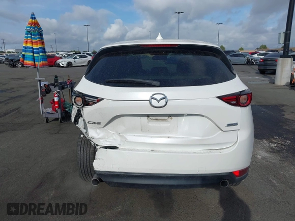 2018 Mazda CX-5 Grand Touring with VIN JM3KFADMXJ0470846, listed as a IAAI auction lot 41913533 with 54,700 mi miles and . Bid and sale history available at DreamBid. Image 17.