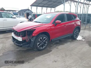 2016 Mazda CX-5 Grand Touring with VIN JM3KE4DY9G0865780, listed as a IAAI auction lot 41913914 with 76,579 mi miles. Bid and sale history available at carsss.com. Image 20.