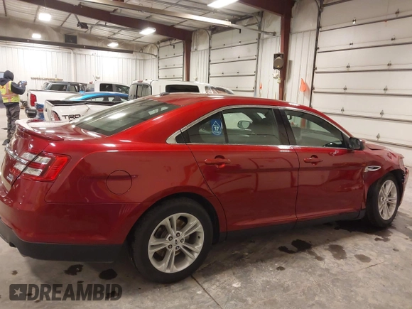 2014 Ford Taurus SEL z VIN 1FAHP2E83EG137639, wystawiony jako IAAI lot #41535259 z przebiegiem 62 978 mil mil oraz . Historia ofert i sprzedaży dostępna na DreamBid. Obrazek 13.