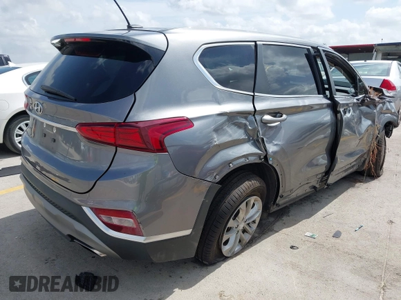 2019 Hyundai Santa Fe SE with VIN 5NMS23AD2KH108936, listed as a IAAI auction lot 42626196 with 72,757 mi miles and . Bid and sale history available at DreamBid. Image 4.