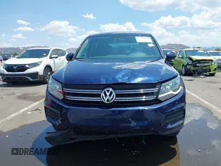 2013 Volkswagen Tiguan with VIN WVGCV3AX6DW605876, listed as a IAAI auction lot 42431619 with 106,279 mi miles and . Bid and sale history available at DreamBid. Image 12.