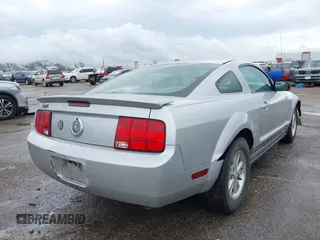 2007 Ford Mustang Deluxe with VIN 1ZVFT80N575245396, listed as a IAAI auction lot 41889599 with 319,148 mi miles. Bid and sale history available at carsss.com. Image 4.