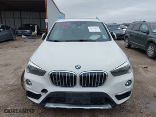 2019 BMW X1 xDrive28i with VIN WBXHT3C51K5L90392, listed as a IAAI auction lot 41571403 with 96,732 mi miles. Bid and sale history available at carsss.com. Image 12.