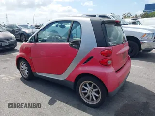 2009 Smart fortwo Pure z VIN WMEEJ31X59K245895, wystawiony jako IAAI lot #42266793 z przebiegiem 120 497 mil mil oraz . Historia ofert i sprzedaży dostępna na DreamBid. Obrazek 3.