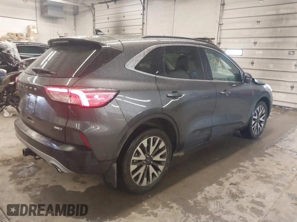 2020 Ford Escape Titanium with VIN 1FMCU9J95LUA39338, listed as a IAAI auction lot 42319122 with 34,631 mi miles and . Bid and sale history available at DreamBid. Image 4.