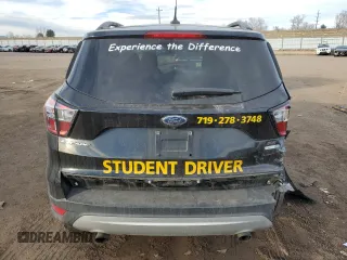 2018 Ford Escape SE z VIN 1FMCU9GDXJUD21466, wystawiony jako Copart lot #46266395 z przebiegiem Nie podano mil oraz Szkoda całkowita • Salvage title. Historia ofert i sprzedaży dostępna na DreamBid. Obrazek 6.