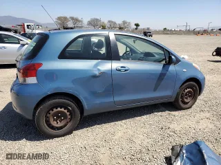 2009 Toyota Yaris with VIN JTDJT903995238147, listed as a Copart auction lot 52369925 with 124,921 mi miles and Salvage Title. Bid and sale history available at carsss.com. Image 3.