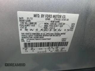 2012 Ford Explorer z VIN 1FMHK7B8XCGA97997, wystawiony jako Copart lot #56319085 z przebiegiem 189 811 mil mil oraz Szkoda całkowita • Salvage title. Historia ofert i sprzedaży dostępna na DreamBid. Obrazek 13.