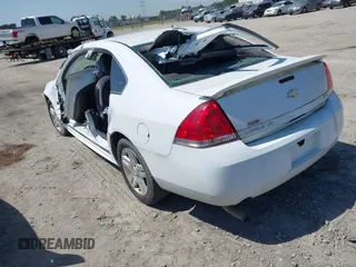 2014 Chevrolet Impala LT with VIN 2G1WB5E30E1136153, listed as a IAAI auction lot 39848599 with 126,676 mi miles and . Bid and sale history available at DreamBid. Image 3.