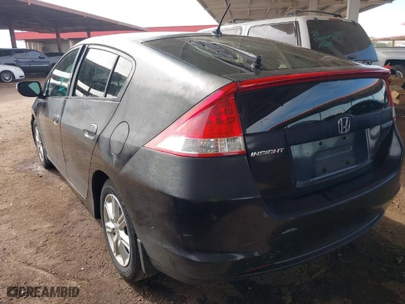 2011 Honda Insight EX with VIN JHMZE2H70BS011379, listed as a IAAI auction lot 41606111 with 220,543 mi miles. Bid and sale history available at carsss.com. Image 3.