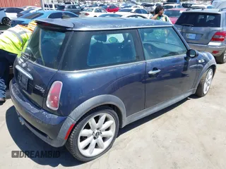 2006 MINI Hardtop S with VIN WMWRE33536TJ35740, listed as a IAAI auction lot 42720196 with 165,852 mi miles and . Bid and sale history available at DreamBid. Image 4.