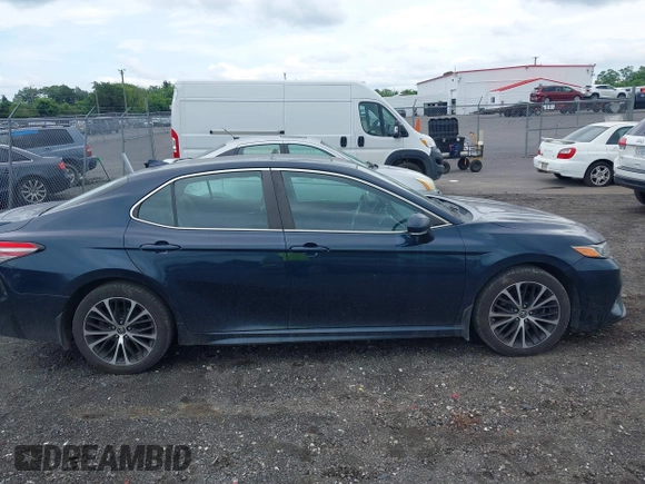 2019 Toyota Camry LE z VIN 4T1B11HK2KU738133, wystawiony jako IAAI lot #42499213 z przebiegiem 203 636 mil mil oraz . Historia ofert i sprzedaży dostępna na DreamBid. Obrazek 13.