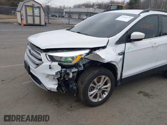 2018 Ford Escape SE z VIN 1FMCU9GD2JUC77186, wystawiony jako IAAI lot #41308133 z przebiegiem 123 156 mil mil oraz . Historia ofert i sprzedaży dostępna na DreamBid. Obrazek 6.