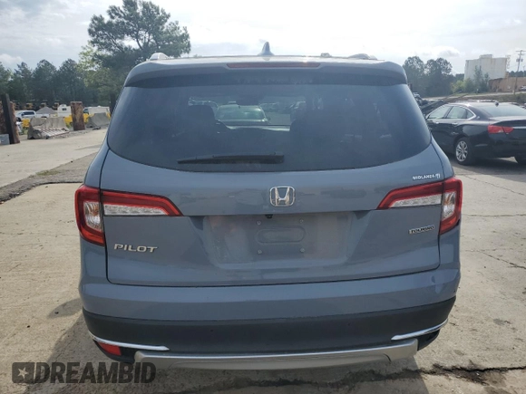 2022 Honda Pilot Touring 7-Passenger z VIN 5FNYF5H69NB031540, wystawiony jako Copart lot #51661185 z przebiegiem 58 316 mil mil oraz Szkoda całkowita • Salvage title. Historia ofert i sprzedaży dostępna na DreamBid. Obrazek 6.