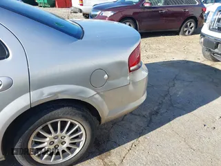 2004 Chrysler Sebring Touring z VIN 1C3EL56R64N113268, wystawiony jako IAAI lot #41746840 z przebiegiem 181 533 mil mil oraz . Historia ofert i sprzedaży dostępna na DreamBid. Obrazek 6.