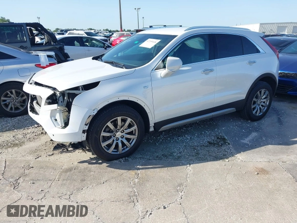2019 Cadillac XT4 FWD Premium Luxury z VIN 1GYFZCR49KF142039, wystawiony jako IAAI lot #42259448 z przebiegiem 47 620 mil mil oraz . Historia ofert i sprzedaży dostępna na DreamBid. Obrazek 2.