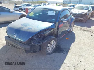 2019 Volkswagen Beetle S with VIN 3VWFD7AT7KM719095, listed as a IAAI auction lot 40919031 with 86,516 mi miles. Bid and sale history available at carsss.com. Image 2.
