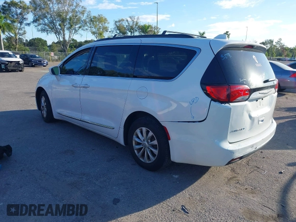 2017 Chrysler Pacifica Touring L with VIN 2C4RC1BG2HR526503, listed as a IAAI auction lot 40264571 with 136,262 mi miles and . Bid and sale history available at DreamBid. Image 3.