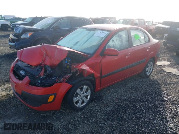 2009 Kia Rio LX with VIN KNADE223796485606, listed as a IAAI auction lot 41676881 with 58,852 mi miles and . Bid and sale history available at DreamBid. Image 2.