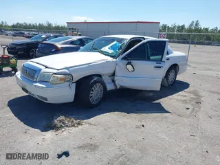 2007 Mercury Grand Marquis LS with VIN 2MEFM75VX7X623356, listed as a IAAI auction lot 41783361 with 157,921 mi miles. Bid and sale history available at carsss.com. Image 2.