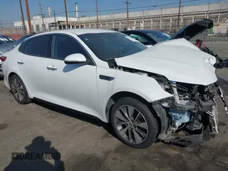 2016 Kia Optima SX Turbo with VIN 5XXGW4L2XGG043934, listed as a IAAI auction lot 40451940 with 86,386 mi miles and . Bid and sale history available at carsss.com. Image 1.