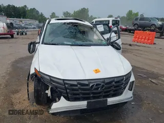 2022 Hyundai Tucson SEL z VIN 5NMJC3AE3NH057663, wystawiony jako IAAI lot #42428386 z przebiegiem 78 740 mil mil oraz . Historia ofert i sprzedaży dostępna na DreamBid. Obrazek 6.