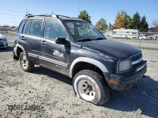 2002 Chevrolet Tracker ZR2 with VIN 2CNBJ734X26948098, listed as a Copart auction lot 73135754 with 234,627 mi miles and Salvage title. Bid and sale history available at DreamBid. Image 4.