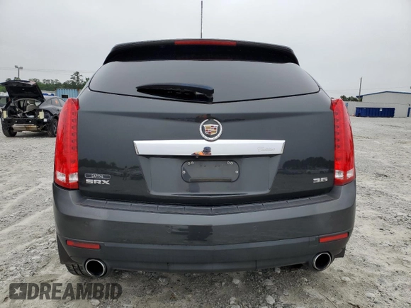 2015 Cadillac SRX Performance Collection with VIN 3GYFNCE38FS597717, listed as a Copart auction lot 57629615 with 102,689 mi miles and Salvage title. Bid and sale history available at DreamBid. Image 6.