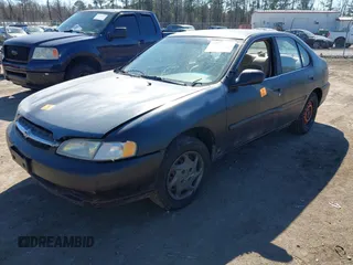 1999 Nissan Altima XE with VIN 1N4DL01D0XC116467, listed as a IAAI auction lot 41705684 with 227,999 mi miles. Bid and sale history available at carsss.com. Image 6.