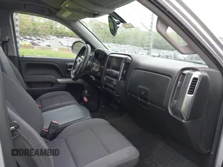 2018 Chevrolet Silverado 1500 LT with VIN 1GCVKREC7JZ151678, listed as a IAAI auction lot 41972011 with 106,892 mi miles and . Bid and sale history available at DreamBid. Image 5.
