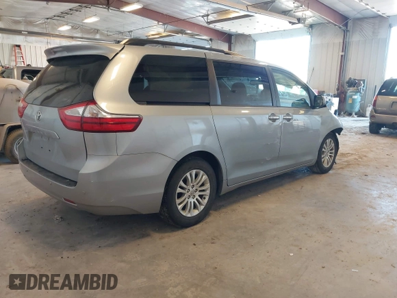 2015 Toyota Sienna XLE with VIN 5TDYK3DCXFS534633, listed as a IAAI auction lot 42018593 with 128,421 mi miles. Bid and sale history available at carsss.com. Image 4.