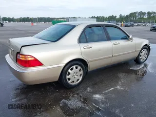 1999 Acura RL with VIN JH4KA9660XC007723, listed as a IAAI auction lot 42039719 with Not provided miles and . Bid and sale history available at DreamBid. Image 4.