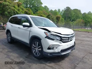 2017 Honda Pilot Touring with VIN 5FNYF5H91HB033359, listed as a IAAI auction lot 42095933 with 163,395 mi miles and . Bid and sale history available at DreamBid. Image 1.