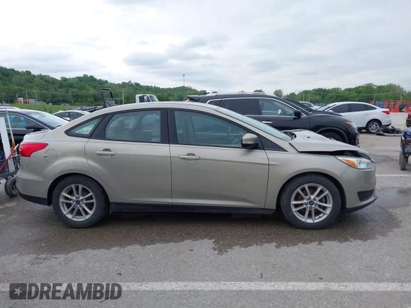 2016 Ford Focus SE z VIN 1FADP3F26GL332224, wystawiony jako IAAI lot #42167222 z przebiegiem 134 423 mil mil oraz . Historia ofert i sprzedaży dostępna na DreamBid. Obrazek 13.