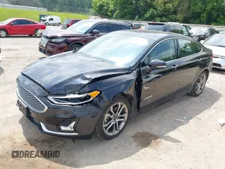 2019 Ford Fusion Titanium z VIN 3FA6P0RU0KR260239, wystawiony jako IAAI lot #42436643 z przebiegiem 114 631 mil mil oraz . Historia ofert i sprzedaży dostępna na DreamBid. Obrazek 6.