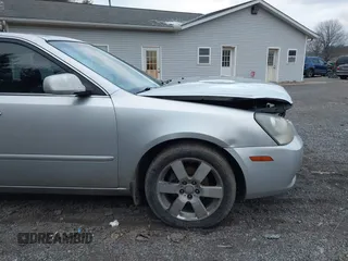 2007 Kia Optima EX with VIN KNAGE124375162317, listed as a IAAI auction lot 41246445 with 174,128 mi miles. Bid and sale history available at carsss.com. Image 13.