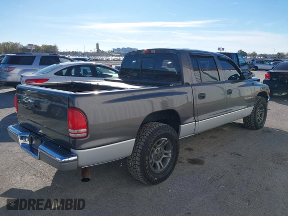 2001 Dodge Dakota Sport with VIN 1B7HL2AN21S319390, listed as a IAAI auction lot 40836729 with 118,823 mi miles. Bid and sale history available at carsss.com. Image 4.