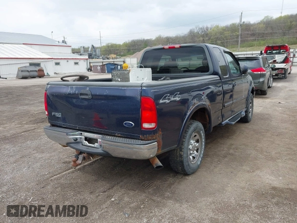 2002 Ford F-150 XL with VIN 2FTPX18L32CA67220, listed as a IAAI auction lot 42077154 with 233,409 mi miles. Bid and sale history available at carsss.com. Image 4.