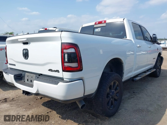 2023 Ram 2500 Laramie with VIN 3C6UR5FL3PG517960, listed as a IAAI auction lot 42128355 with 101,733 mi miles and . Bid and sale history available at DreamBid. Image 4.