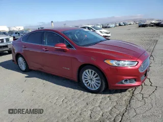 2015 Ford Fusion SE Hybrid with VIN 3FA6P0LU5FR184127, listed as a Copart auction lot 62117645 with 163,487 mi miles and Salvage title. Bid and sale history available at DreamBid. Image 4.