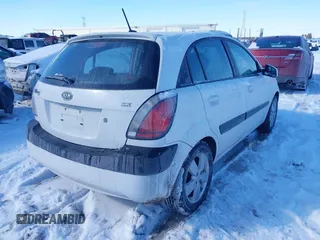 2009 Kia Rio LX with VIN KNADE243196500999, listed as a IAAI auction lot 41582717 with 119,877 mi miles. Bid and sale history available at carsss.com. Image 4.