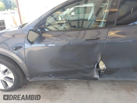 2023 Tesla Model Y Long Range with VIN 7SAYGAEE4PF906577, listed as a IAAI auction lot 42174987 with 13,260 mi miles and . Bid and sale history available at DreamBid. Image 6.