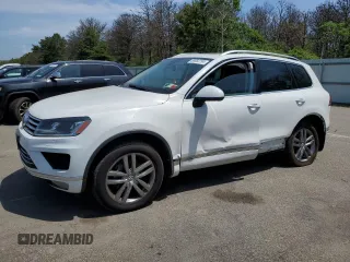 2016 Volkswagen Touareg Sport with VIN WVGEF9BPXGD010830, listed as a Copart auction lot 58663734 with 148,091 mi miles and Salvage Title. Bid and sale history available at DreamBid. Image 1.