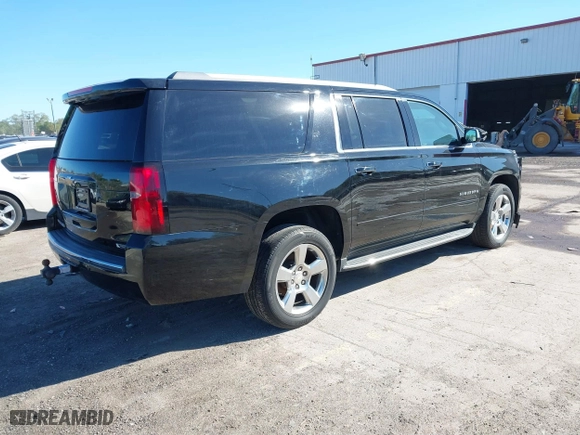 2017 Chevrolet Suburban Premier with VIN 1GNSKJKC0HR114398, listed as a IAAI auction lot 41745611 with 211,906 mi miles. Bid and sale history available at carsss.com. Image 4.