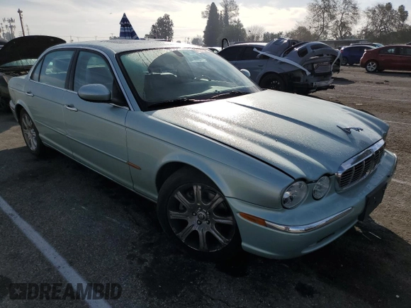 2005 Jaguar XJ with VIN SAJWA79C15SG47018, listed as a Copart auction lot 43087185 with 31,725 mi miles and Salvage Title. Bid and sale history available at carsss.com. Image 4.