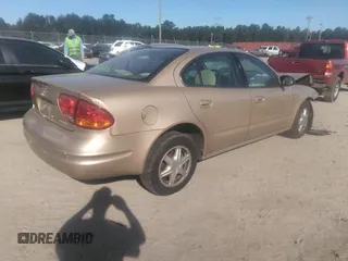 2004 Oldsmobile Alero GL1 z VIN 1G3NL52E54C184505, wystawiony jako IAAI lot #40561842 z przebiegiem 21 779 mil mil oraz . Historia ofert i sprzedaży dostępna na DreamBid. Obrazek 4.